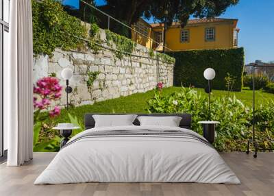 stone wall with grass n the garden Wall mural