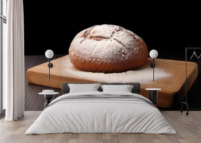 bread/ bread, flour sprinkled on an oak board on a dark background Wall mural