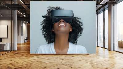 Young woman immersed in virtual reality experience wearing VR headset modern depiction of futuristic technology and networked entertainment showcasing joy and innovation of digital simulation Wall mural