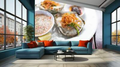 Fresh Oyster Thai style with spicy sauce serve with Chili paste, crispy shallots, garlic and fresh vegetable. Wall mural