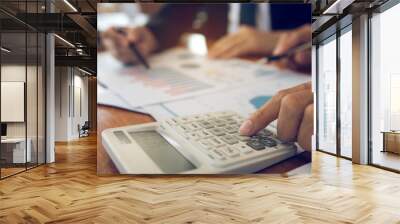 Two businessmen discussion analysis sharing calculations about the company budget and financial planning together on desk at the office room. Wall mural