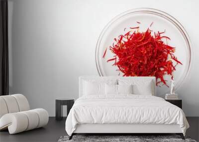 dry red saffron strands in petri dish, solid white background top view  Wall mural