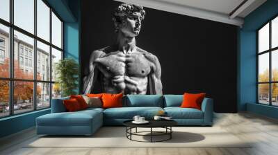 Marble statue of a 20-year-old man, fit and muscular build, defined abs, toned arms and chest, sharp focused look, black simple background Wall mural