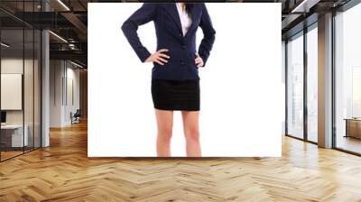 Beautiful businesswoman standing with hands on hips isolated on Wall mural