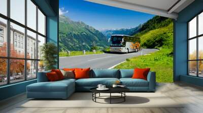 Bus on a road in Alps Wall mural