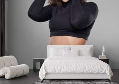 Curvy woman doing fitness exercises Wall mural