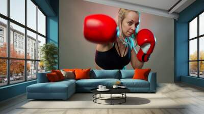 Female boxer with gloves on Wall mural