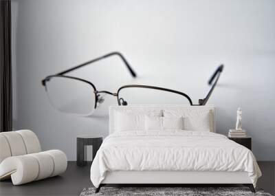 Reading glasses on white Wall mural