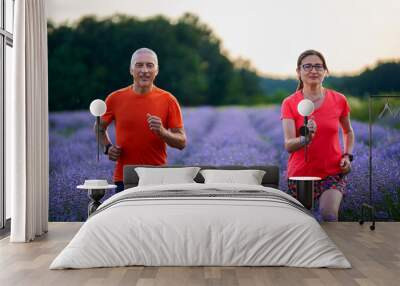 Runners couple in a lavender field Wall mural