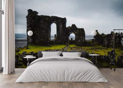 A Scottish castle by the sea is decaying, with old stones and old walls in a bleak landscape. It gives a feeling of escape and freedom to those visiting the north of Europe. 3D illustration. Wall mural