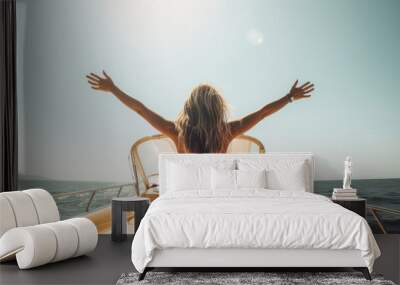 A young blonde woman enjoys a boat trip and feels joy as she raises her arms. She looks out over the turquoise summer ocean from her luxurious cruise. Generative AI Wall mural