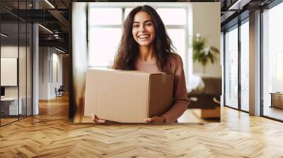 Radiant young woman with dark hair, carrying large box during a move. Empty, illuminated apartment as backdrop. Symbol of fresh start and new life. Generative AI Wall mural