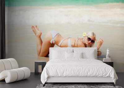 stylish sexy blonde lying on the beach Wall mural