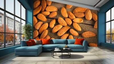 Almonds on wooden background Wall mural