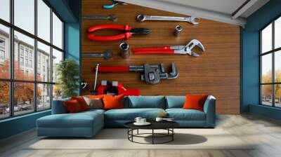 
Assorted red tool set, screwdriver, pliers, saw  Wall mural