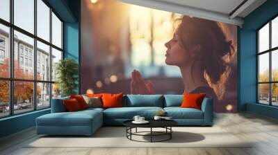 Young Woman Praying to god in church Wall mural