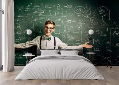 panorama of nerd student with classic outfit standing with a chalkboard background Wall mural