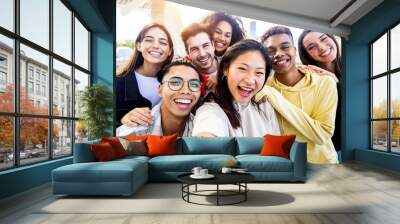 Diverse group of happy young best friends having fun taking selfie photo together - International youth community people concept with multiethnic teenage people smiling at camera on self portrait Wall mural