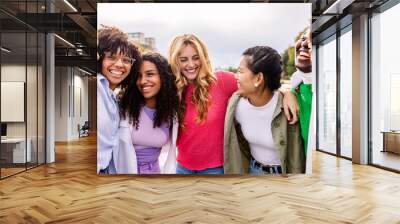 Happy young group of diverse girls having fun at city street. Female community and friendship concept. Wall mural