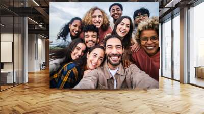 Multiracial young group of happy people taking selfie portrait - Millennial diverse friends laughing and having fun together Wall mural