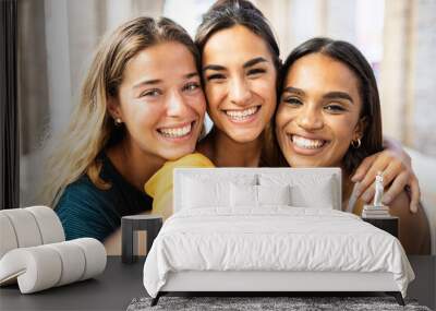 Three multi ethnic young female friends laughing together taking selfie outdoors - Multiracial women having fun on summer vacation in Italy - Unity happy people and friendship concept Wall mural