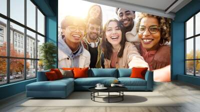 United group of happy young friends having fun while taking a selfie with mobile phone outdoors - Diverse group of millennial people laughing together during vacation - Friendship and holidays concept Wall mural