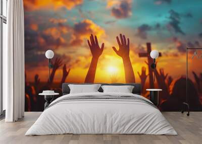 hands raised up to a cross with sunset background Wall mural