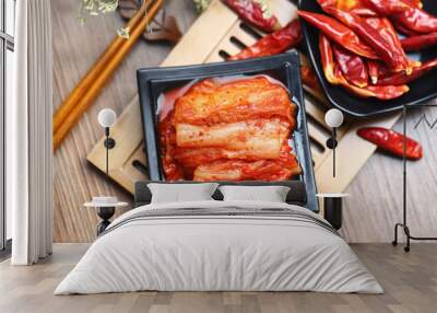 Korean kimchi in black plate on bamboo Wall mural