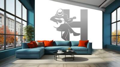 Silhouette of person playing guitar beside letter H illustration Wall mural