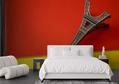 Statue of the Paris tower on red and yellow backgrounds Wall mural