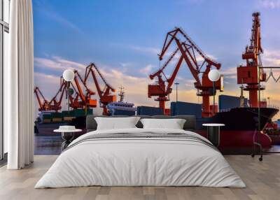 Heavy Loader Working in a Harbour in the Background of Sunset Wall mural