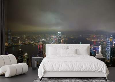 Hong Kong city skyline panorama at night with Victoria Harbor and skyscrapers Wall mural