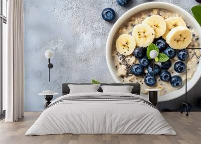 Breakfast oatmeal porridge with banana, blueberry Wall mural