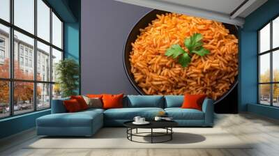 A close up of a bowl of red rice garnished with parsley, sitting on a black background Wall mural