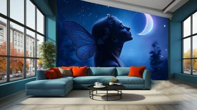 A fairy with wings gazing at the moonlit night sky Wall mural