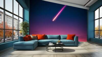 A pink streak of light from a shooting star cuts through a dark blue sky with a starry background, as a silhouette of a mountain range sits at the bottom of the frame Wall mural