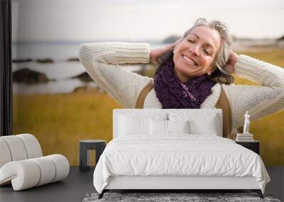 mature woman stretching Wall mural