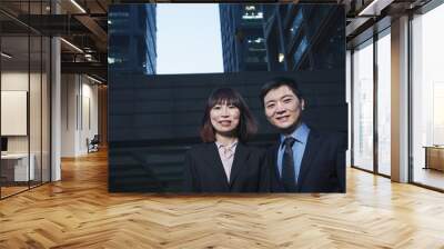 Portrait of two business people outdoors among skyscrapers in Beijing Wall mural