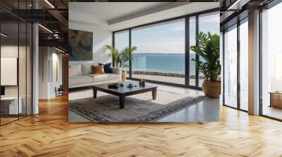 Indoor plant on white floor with lounge and coffee table near sea-view window in luxury beach house Wall mural