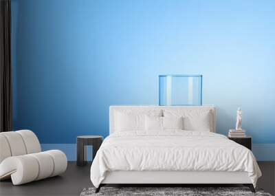 Water glass on blue background Wall mural