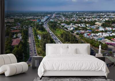 Aerial view of Rach Mieu Bridge cross Tien river, link Tien Giang with Ben Tre, cable stayed bridge at Mekong Delta, boat traffic on water, vehicle on road Wall mural