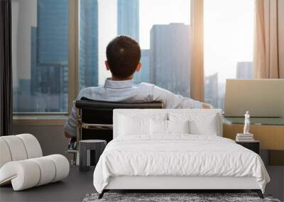 Businesswoman sitting in front of the window Wall mural