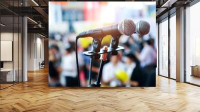 Closeup microphone in auditorium with blurred people in the background Wall mural