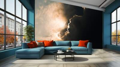 Rays of light shining through dark clouds Wall mural