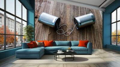 Tin cans telephone on wooden table Wall mural