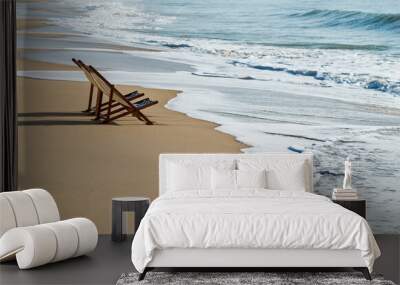 Two chairs on the beach. Wall mural