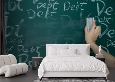 Wiping debt on a chalkboard Wall mural