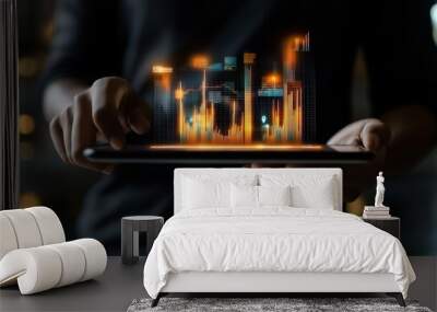 A person holds a tablet displaying vibrant, animated data visualization, representing digital analytics and modern technology in a dimly lit environment Wall mural