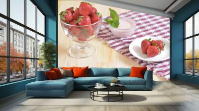 Strawberry in a bowl on a wooden table Wall mural