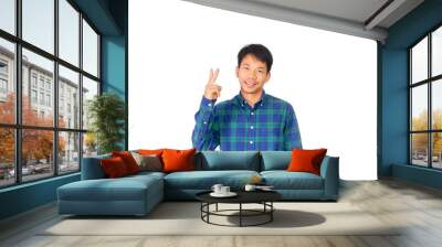 An Asian untidy man in blue plaid shirt is showing number two symbol by his fingers. Wall mural